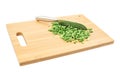 Cut in pieces green onion over cutting board Royalty Free Stock Photo