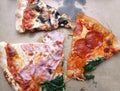 Cut pieces of Quatro Stagioni pizza in cardboard box. Royalty Free Stock Photo