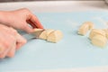 Cut pieces from rolled dough for cookies Royalty Free Stock Photo