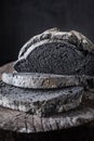 Cut into pieces of unusual black bread Royalty Free Stock Photo