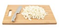 Cut in pieces white cabbage over cutting board Royalty Free Stock Photo
