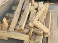 Cut pieces of wood used for shuttering and stacked at site used nails which are near miss