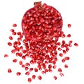 Cut the pomegranate with scattered grain top view isolated Royalty Free Stock Photo