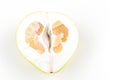 Cut pomelo on a white background. Unripe. Small inside. Place for an inscription. Easy cut. View from above. close-up