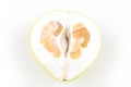 Cut pomelo on a white background. Unripe. Small inside. Place for an inscription. Easy cut. View from above. close-up