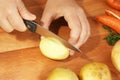 Cut potato to make vegetable soup Royalty Free Stock Photo