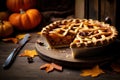 Cut pumpkin pie revealing a rich golden spiced filling is elegantly served on a rustic wooden table Royalty Free Stock Photo