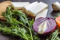 Cut red onions, tomato, dill, lard salo and garlic on wooden table Royalty Free Stock Photo