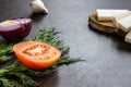 Cut red onions, tomato, dill, lard salo and garlic on wooden table. Royalty Free Stock Photo