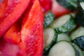 Cut red pepper and green cucumber closeup