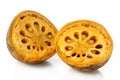 Cut ripe bael fruit on white Royalty Free Stock Photo