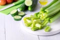 Cut Ripe Fresh Celery on White Cutting Board Healthy Diet Food Cucumber Vegetables Royalty Free Stock Photo