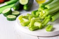 Cut Ripe Fresh Celery on White Cutting Board Healthy Diet Food Cucumber Vegetables Royalty Free Stock Photo