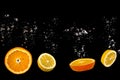 Citrus Burst: Cut Orange and Lemon Shards Floating in Bubbly Water