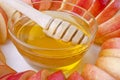 Cut into slices of apples with a bowl of honey Royalty Free Stock Photo
