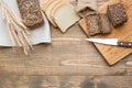 Fitness bread. A loaf of fresh rustic whole rye bread, sliced on wooden board, rural food background. Top view. Copy space Royalty Free Stock Photo