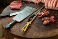 Cut steaks and meat cleaver butcher shop Royalty Free Stock Photo