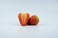 Two strawberries isolated on white background, cut apart,close up.