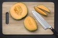 Cut sugar melon on a chopping board.