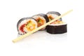 Cut Sushi Rolls and Disposable Chopsticks Royalty Free Stock Photo