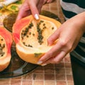 Cut into two parts papaya fruit with seeds