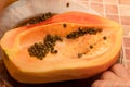 Cut into two parts papaya fruit with seeds