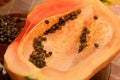 Cut into two parts papaya fruit with seeds