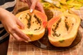 Cut into two parts papaya fruit with seeds