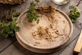 Cut-up nettle roots collected in spring - ingredient to prepare herbal tincture