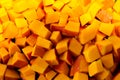 Diced pieces of pumpkin cut up and prepared for soup Royalty Free Stock Photo