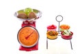 Cut vegetables in bowls fruit on kitchen scales