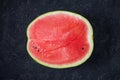 Cut watermelon on a darkgrey background.