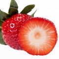 Cut and whole fresh fruits of red strawberry isolated on white background Royalty Free Stock Photo