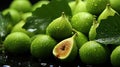 Cut and whole fresh green figs with leaves