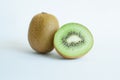 Cut and whole fresh kiwis on white background vertical