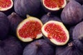 Cut and whole fresh ripe figs as background, top view Royalty Free Stock Photo