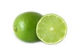 Cut and whole lime fruits isolated on white Royalty Free Stock Photo