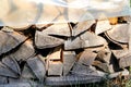 Cut wood, firewood for the winter. Cut logs fire wood and ready pieces of wood for heating wood. Royalty Free Stock Photo