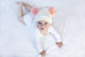 Cute adorable baby child with warm white and pink hat with cute bobbles Royalty Free Stock Photo