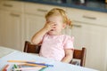 Cute adorable baby girl learning painting with pencils. Little toddler child drawing at home, using colorful felt tip Royalty Free Stock Photo