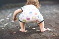 Cute adorable baby girl making first steps outdoors. Healthy happy toddler child learning walking. Lovely girl enjoying Royalty Free Stock Photo