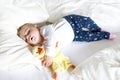 Cute adorable baby girl of 6 months sleeping peaceful in bed