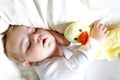 Cute adorable baby girl of 6 months sleeping peaceful in bed Royalty Free Stock Photo