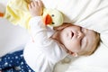 Cute adorable baby girl of 6 months sleeping peaceful in bed Royalty Free Stock Photo