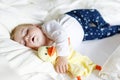 Cute adorable baby girl of 6 months sleeping peaceful in bed Royalty Free Stock Photo