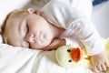 Cute adorable baby girl of 6 months sleeping peaceful in bed Royalty Free Stock Photo