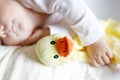 Cute adorable baby girl of 6 months sleeping peaceful in bed Royalty Free Stock Photo
