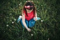 Cute adorable Caucasian girl picking flowers dandelions. Royalty Free Stock Photo