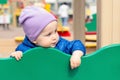 Cute adorable caucasian toddler boy enjoy having fun at outdoor playground. Portrait of happy little child playing ouside Royalty Free Stock Photo