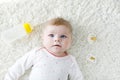 Cute adorable ewborn baby girl holding nursing bottle and drinking formula milk Royalty Free Stock Photo